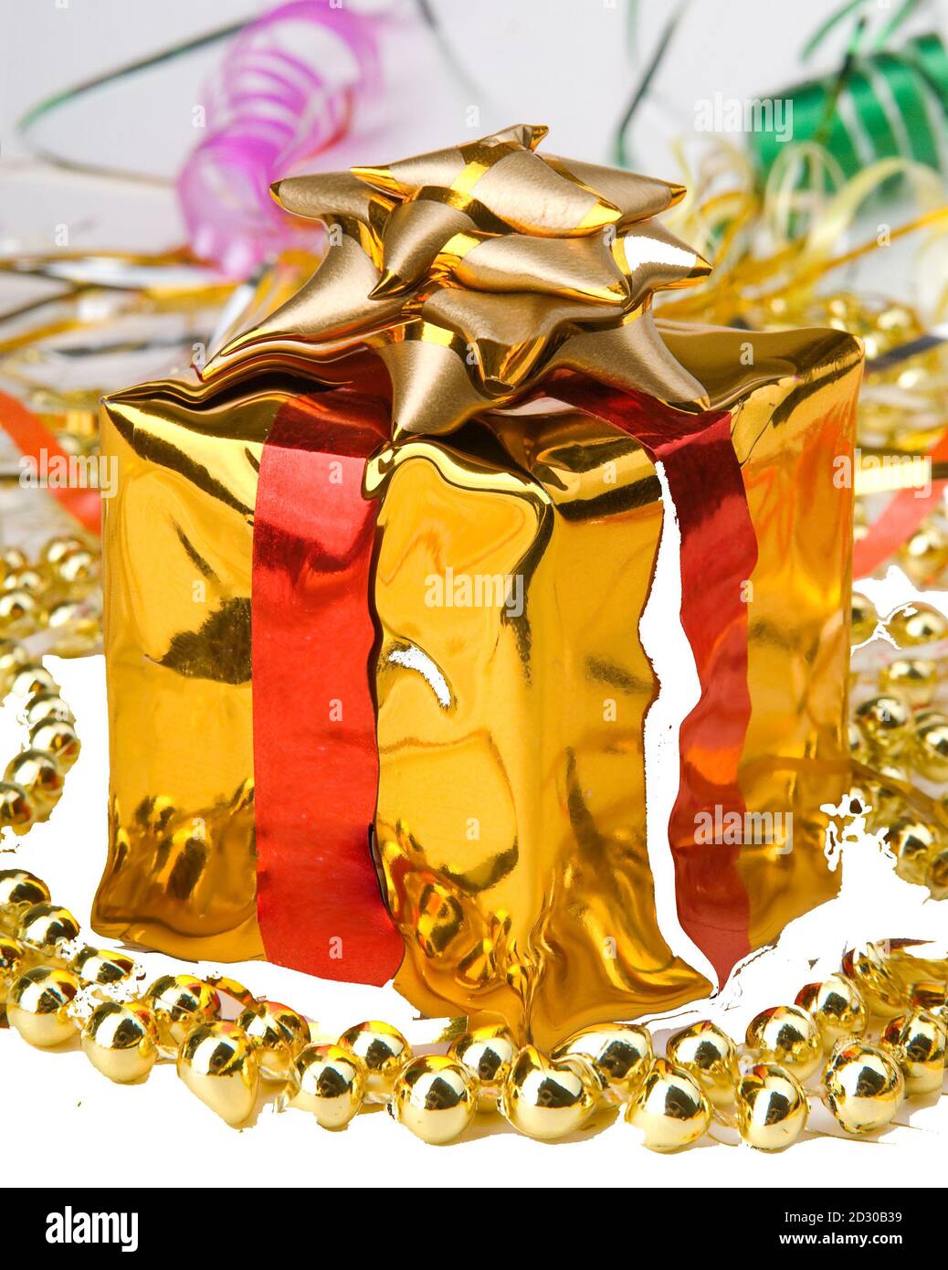 New Year's gift wrapped in gold paper Stock Photo Alamy