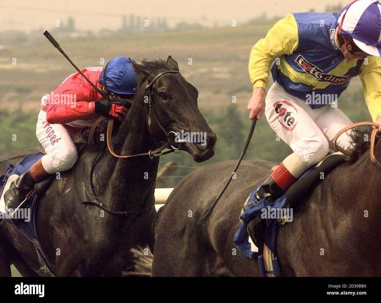 Kieren Fallon on Audition (l) is beaten into third place on a horse trained by Sir Michael Stoute behind eventual second Smart Predator ridden by Jimmy Quinn and the eventual winner Bassinello in the Matty Brown Memorial Maiden Stakes at Pontefract Races. Stock Photo
