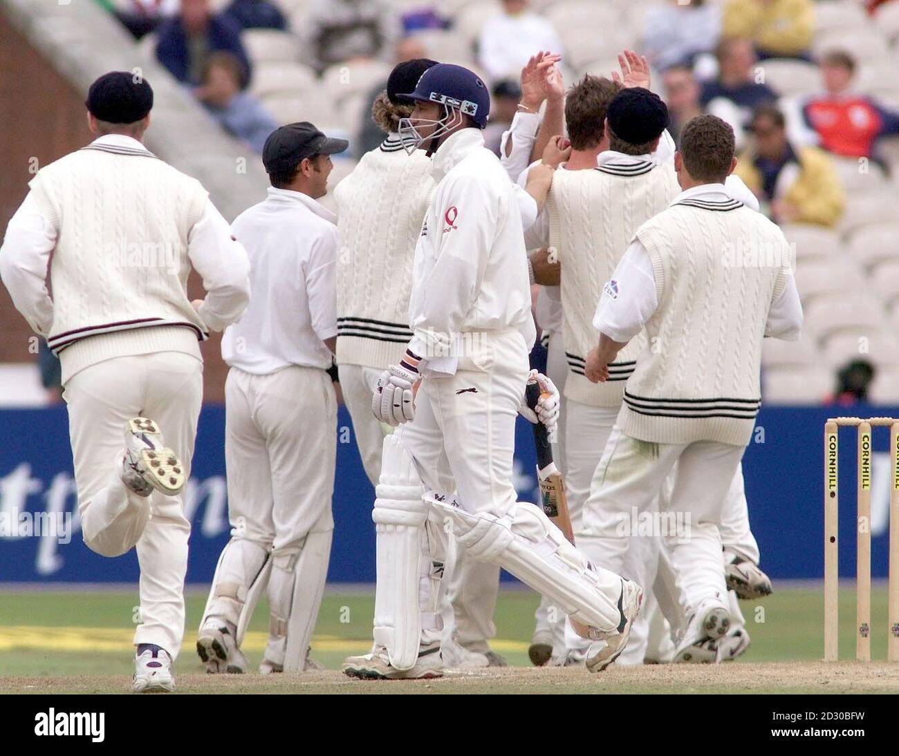 New Zealand celebrate as England captain Mark Butcher is given out lbw for nine runs, bowled Dion Nash, in the Third Test at Old Trafford. Stock Photo