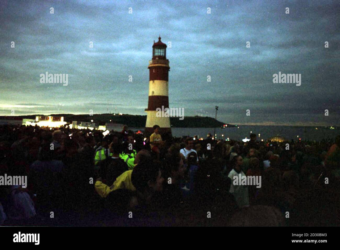 Darkened skies during the total eclipse over Plymouth Sound, where thousands of watchers joined together to experience the spectacular event. Stock Photo