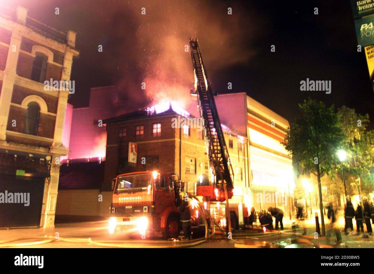 Firemen fight a blaze at a Kentucky Fried Chicken restaurant  in Londonderry.  Buildings and cars were set alight and shops looted as violence flared on the streets of Londonderry in the wake of the Loyalist Apprentice Boys parade. Stock Photo