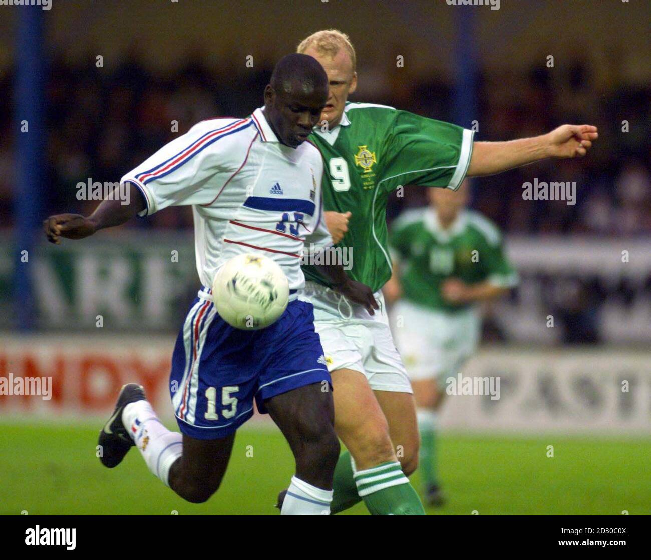 France's Liliam Thuram and Northern Ireland's Ian Dowie in action during their Friendly International at Windsor Park, Belfast. Stock Photo