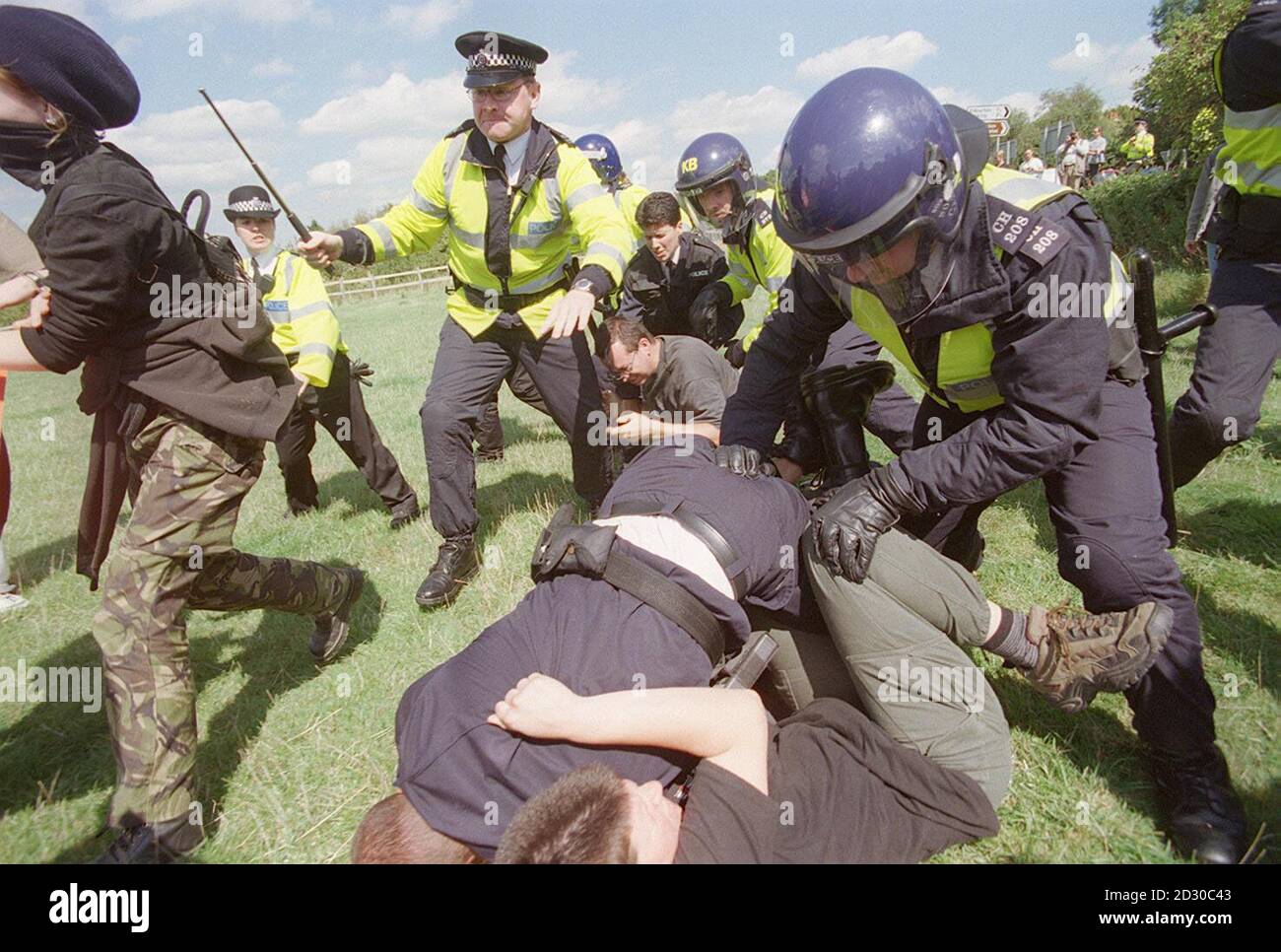 Police clash with demonstrators, as more than 200 animal rights protesters stage a rally outside Shamrock Farm in Small Dole, near Henfield, West Sussex, opposing the farm's importation of macaque monkeys into Britain to be used in medical testing. Stock Photo