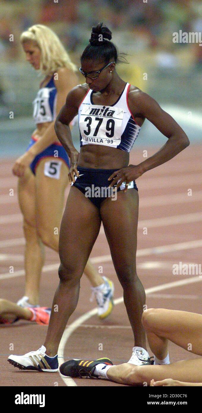 Britain's Denise Lewis recovers after running the final part of the heptathalon, the 800m, at the IAAF World Athletics Championships in Seville. Lewis took the silver medal in the event, with France's Eunice Barber taking gold. Stock Photo