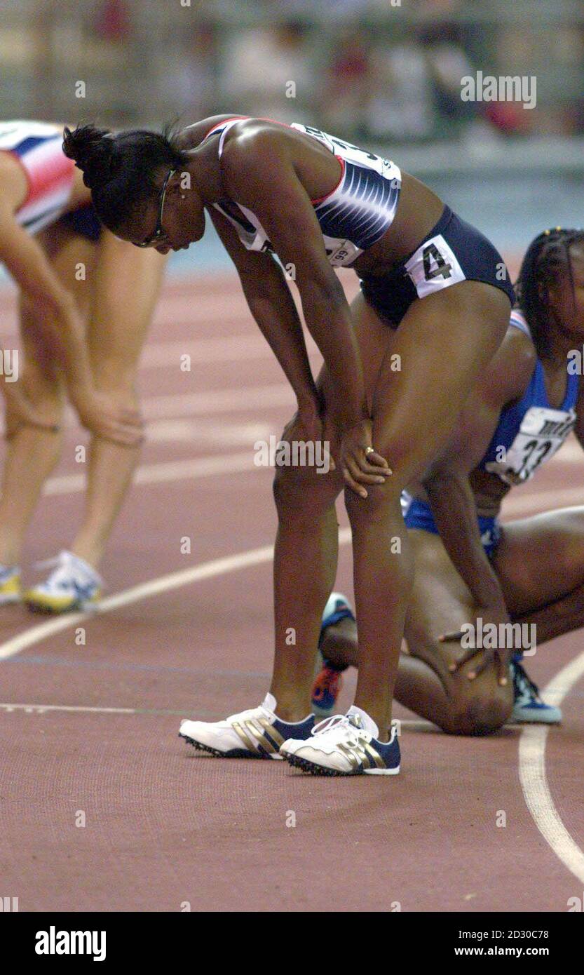 Britain's Denise Lewis recovers after running the final part of the heptathalon, the 800m, at the IAAF World Athletics Championships in Seville. Lewis took the silver medal in the event, with France's Eunice Barber taking gold.  Stock Photo