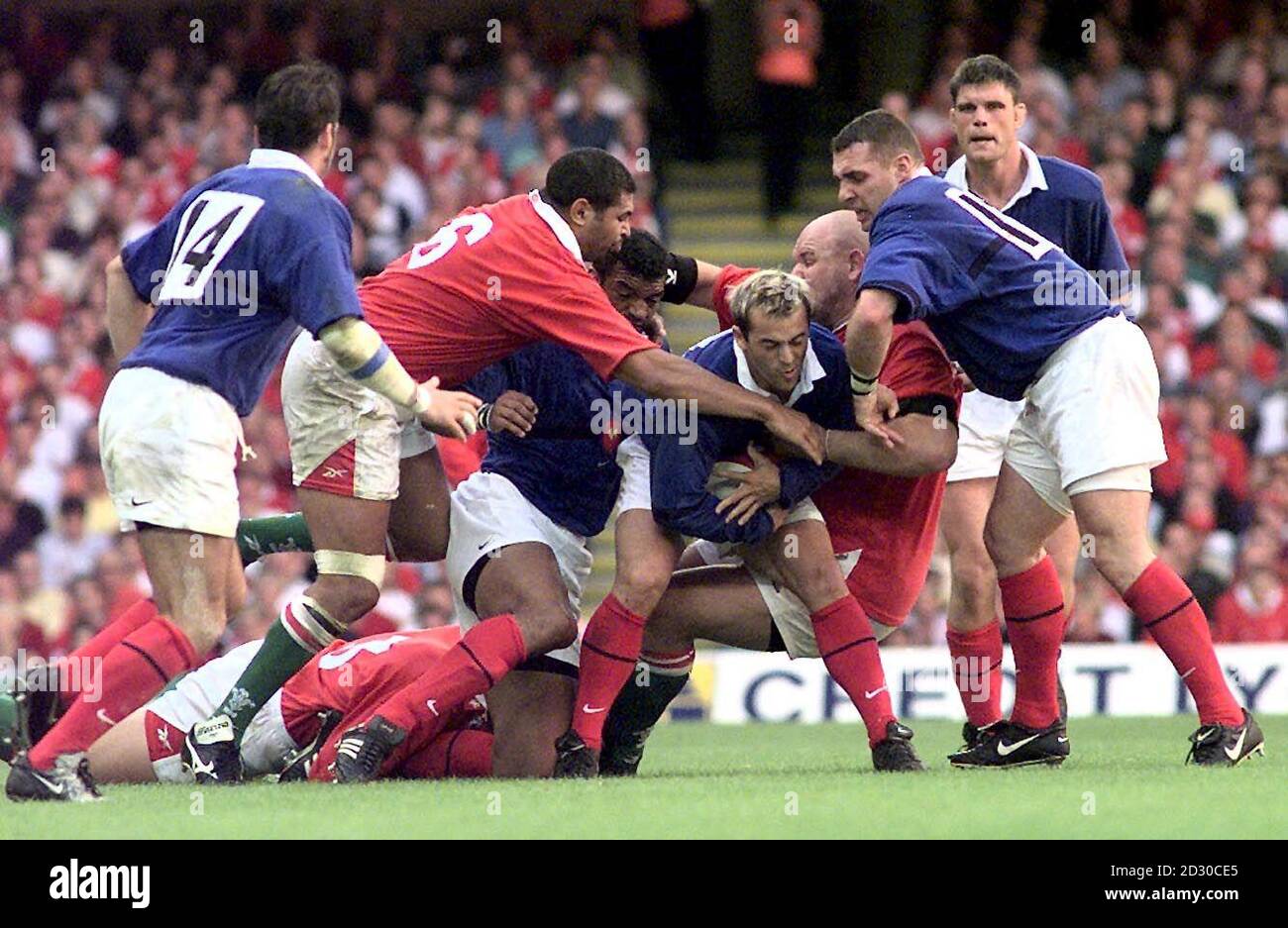 Wales's defence in the shape of Colin Charvis (no 6) and Craig Quinnell tie up France's Thomas Castaignede during final World Cup warm up match before the start of the competition on October 1st. Wales won the match 34-23.  Stock Photo