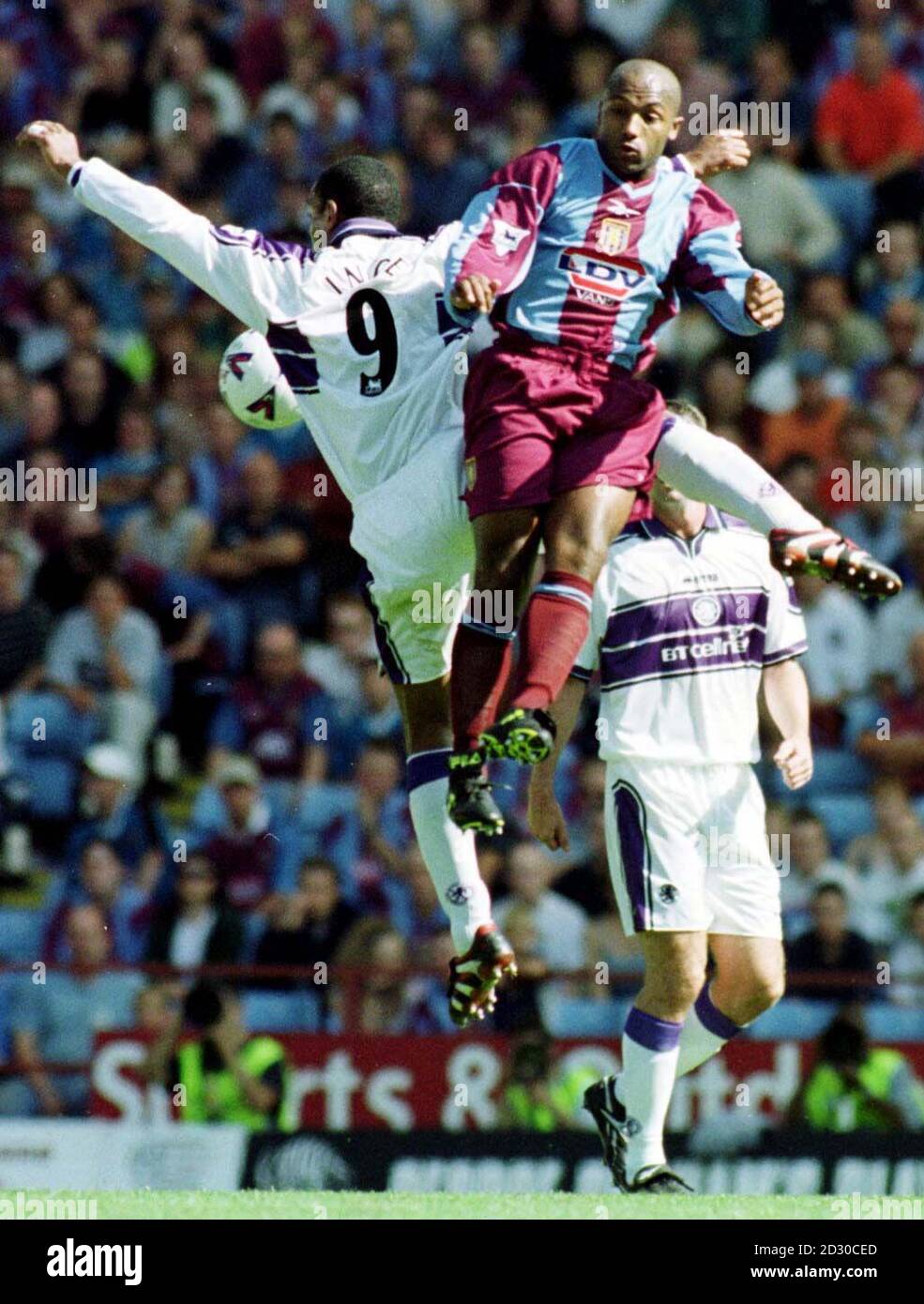 Aston Villa's Julian Joachim tries to out jump Paul Ince during the Premiership match between Aston Villa v Middlesbrough at Villa Park. Stock Photo