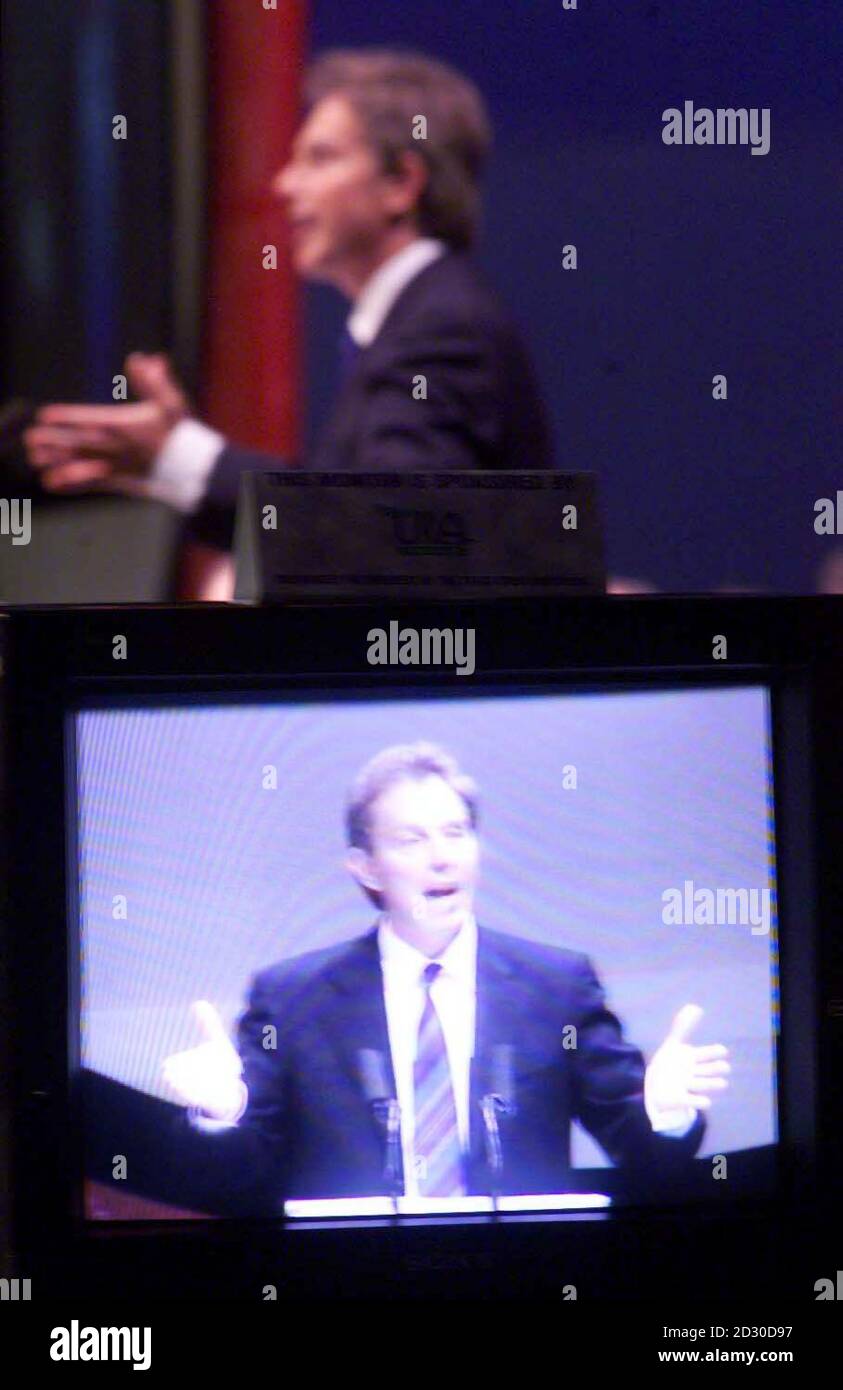 Prime Minister Tony Blair viewed on a television monitor delivering his