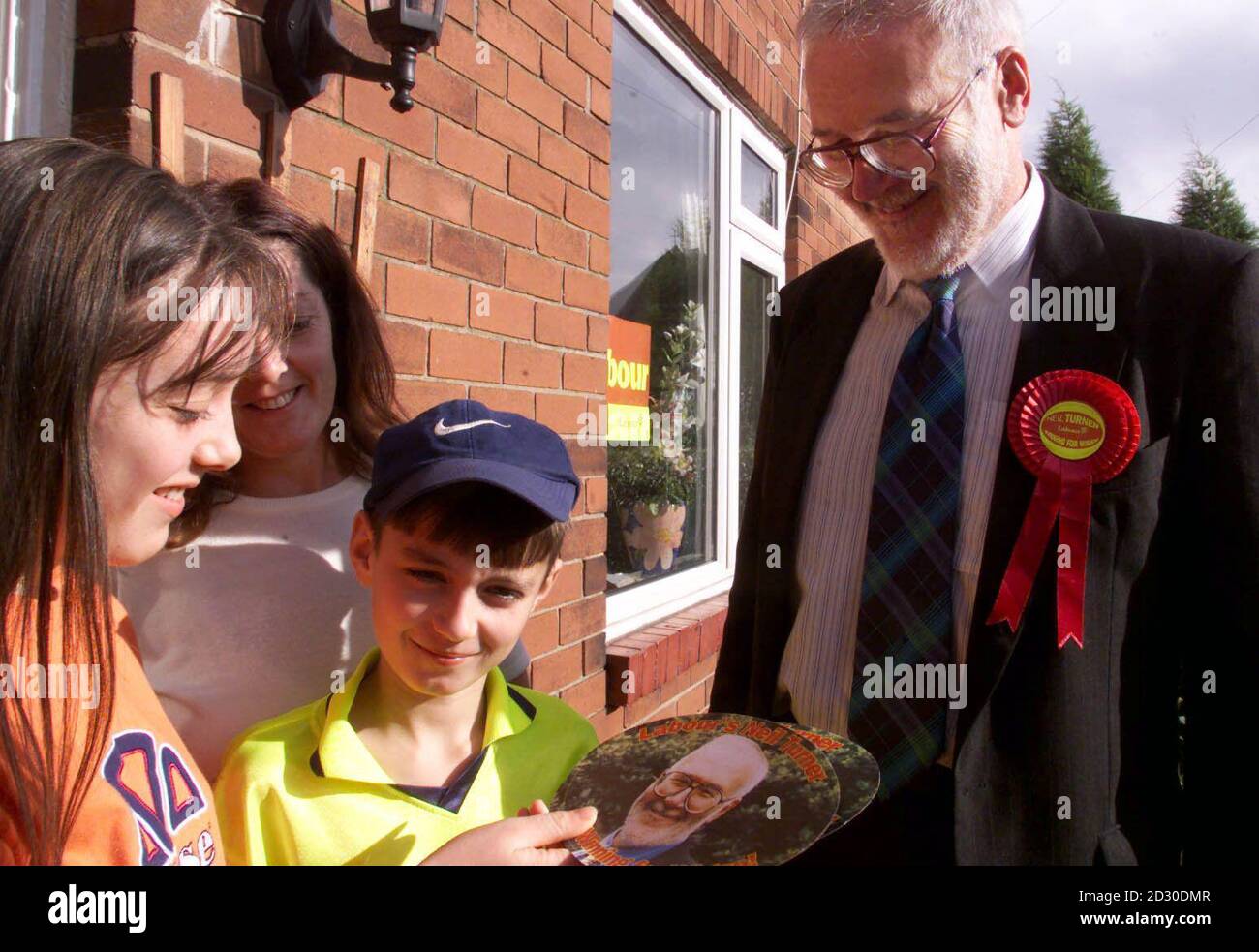 Labour candidate Neil Turner talks to local residents while campaigning ...