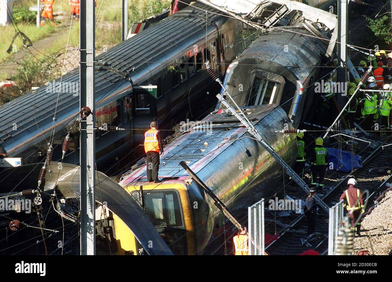 Rescue workers at the scene of a train crash in west London.  A number of passengers were feared to have died in the accident, and hundreds more were injured when two mainline trains collided near London's Paddington Station at the height of the morning rush hour.   * Carriages were set ablaze by the collision and derailment, and scores of passengers were still trapped two hours after the crash about two miles from Paddington main line station. Stock Photo