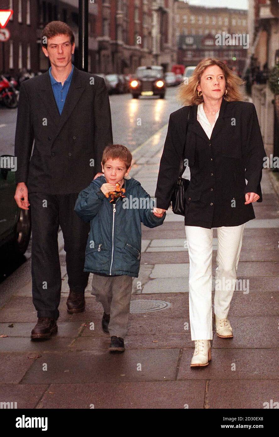 Robert Loveday and Mandy Evans with their son Luke at the General Medical Council, London.  Joshua, the couple's younger son died in 1995 after an operation conducted by Mr Dhasmana. 12/10/99: Professor Angelini told the inquiry he tried to stop the operation.  * on Joshua. 27/11/99:  to hear the continuing case against Bristol Royal Infirmary consultant surgeon, Mr Dhasmana, who is accused of continuing open heart surgery on children despite warnings about the high death rate. 12/11/99: Joshua's father became depressed and involved in petty crime before he was found dead, hanging, in Winson G Stock Photo