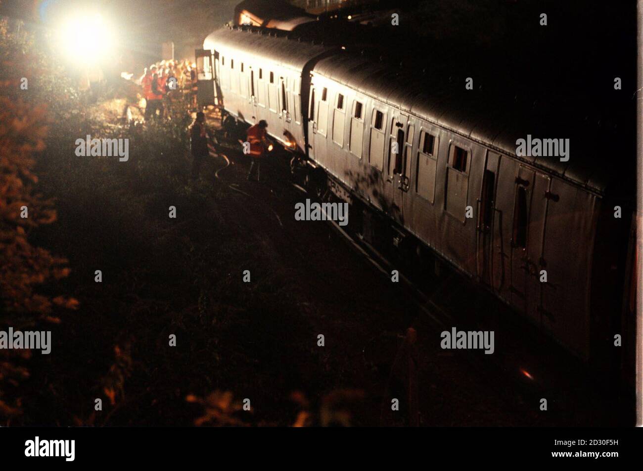 Railway engineers attend the scene outside Lewes Station, in east Sussex, after a busy commuter train hit a slow-moving train at a junction. No one was injured in the collision which came just 13 days after the Paddington rail disaster.  Stock Photo