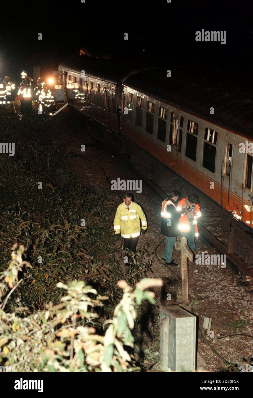 Railway engineers attend the scene outside Lewes Station, in east Sussex, after a busy commuter train hit a slow-moving train at a junction. No one was injured in the collision which came just 13 days after the Paddington rail disaster. Stock Photo