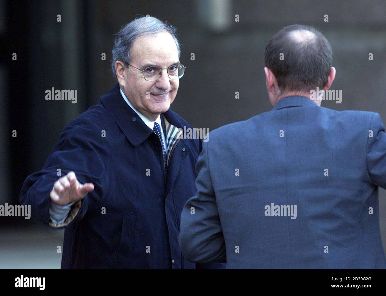 Senator George Mitchell (left) arrrives at Castle Buildings Belfast to continue the search to break the deadlock in the Northern Ireland peace talks. Sinn Fein is believed to be poised to issue a statement deploring  political violence in an effort to break the deadlock.  * ...in the Northern Ireland peace process. At the same time a senior IRA member could be nominated to negotiate over weapons with General John de Chastelain, chairman of the International Decommissioning Commission.   Stock Photo