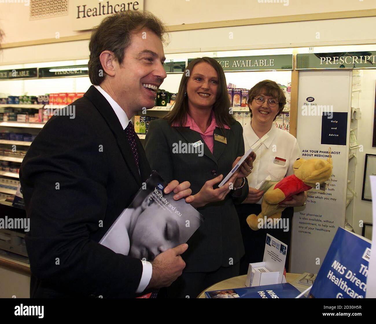 Prime Minister Tony Blair visited The Strand Shopping Centre in Bootle close to Liverpool, where he received a baby book and cuddly toy for the expectant Blair family, from the staff at 'Boots' chemist.  *This is the second day of the Prime Minister's trip to the north-west of England as part of a tour to Stock Photo