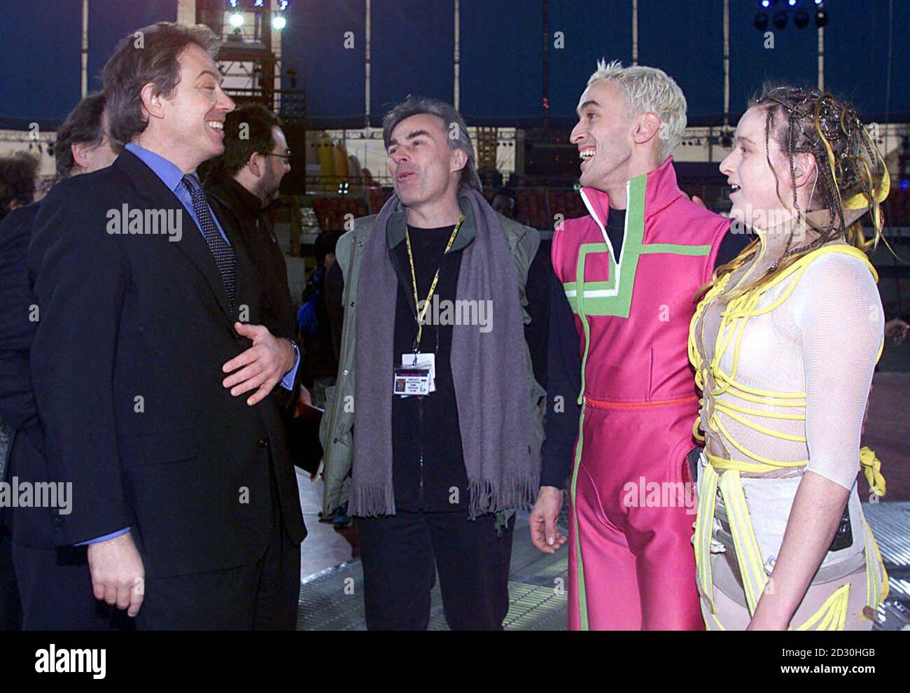 Prime Minister Tony Blair (left) talks to aerial acrobatic dancers Matt Costain (2nd right) and Corinne Pierre (right) who performed the Lovers Duet, which is to be one of the main events of the Millennium Dome celebrations.  * ...during his visit to the Dome in Greenwich. Stock Photo