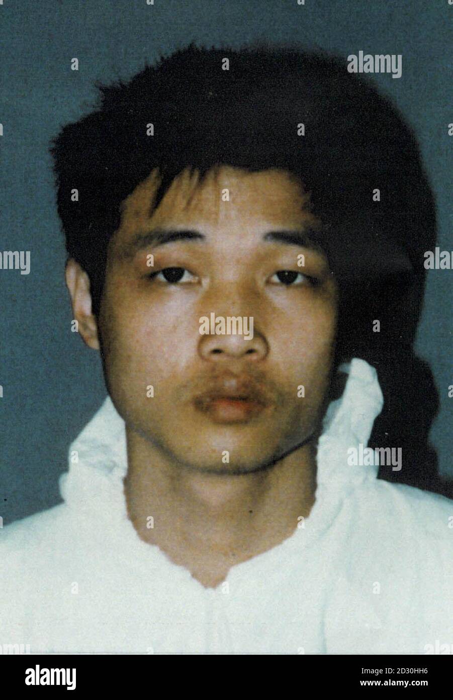 Police issued photo of Shun Chiu Kong, jailed for 7 years at Kingston Crown Court, resulting from a police action that smashed a lucrative people smuggling and extortion racket by a ruthless gang known as Snakeheads who kidnapped illegal immigrants. * They then demanded ransoms of tens of thousands of pounds from poor relatives in China. The Metropolitan Police claimed a major victory against the gangs at the end of a series of trials which have led to the conviction of 19 Chinese men and women. Stock Photo