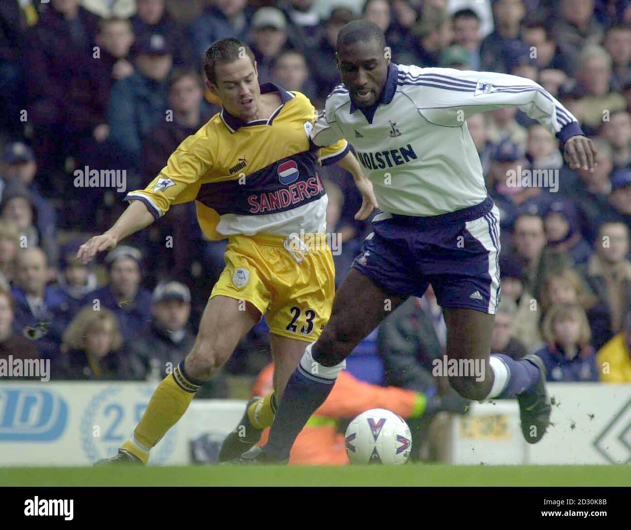 This picture can only be used within the context of an editorial feature. Tottenham Hotspur's Sol Campbell (R) battles for the ball with Sheffield Wednesday's Gilles de Bilde during their FA Premiership football match at White Hart Lane. Stock Photo