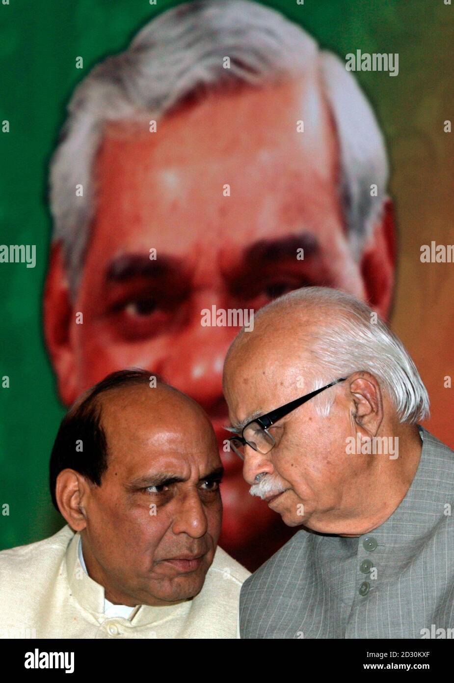 President of India's main opposition Bharatiya Janata Party (BJP) Rajnath  Singh (L) speaks with leader Lal Krishna Advani during the release of their  party's manifesto for the April/May general election in New