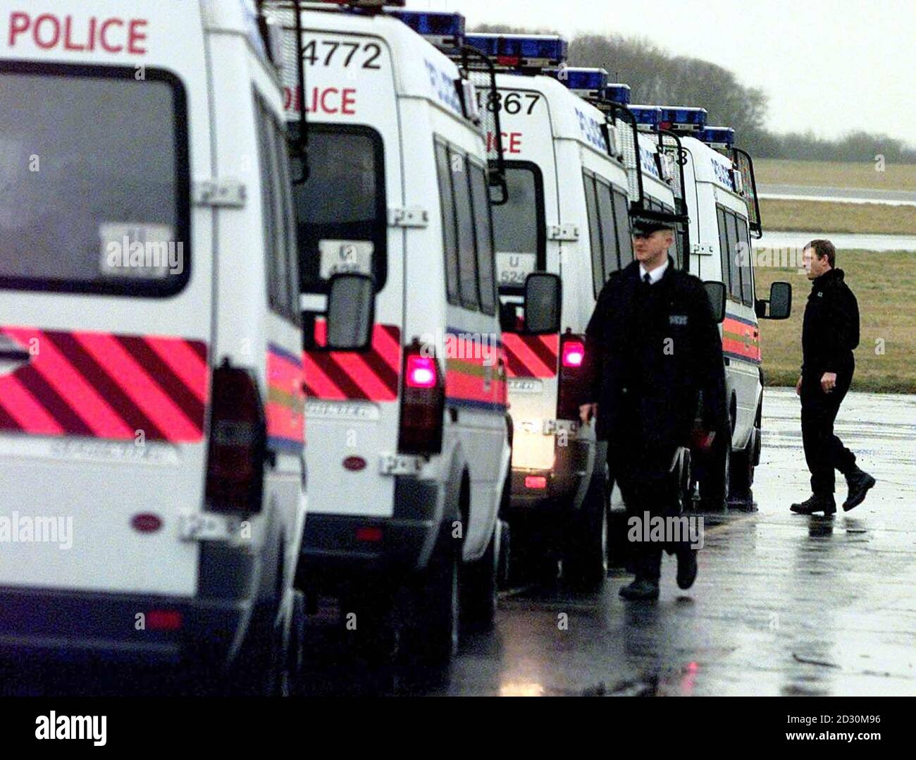 A large police presence situated at Stansted airport, on-standby as negotiations for the hijacked Ariana Airlines Boeing 727 continues, where about 150 people, including 21 children, are being held by up to 10 armed hijackers. * The hijackers seized control of the jet on an internal flight in Afghanistan. Stock Photo