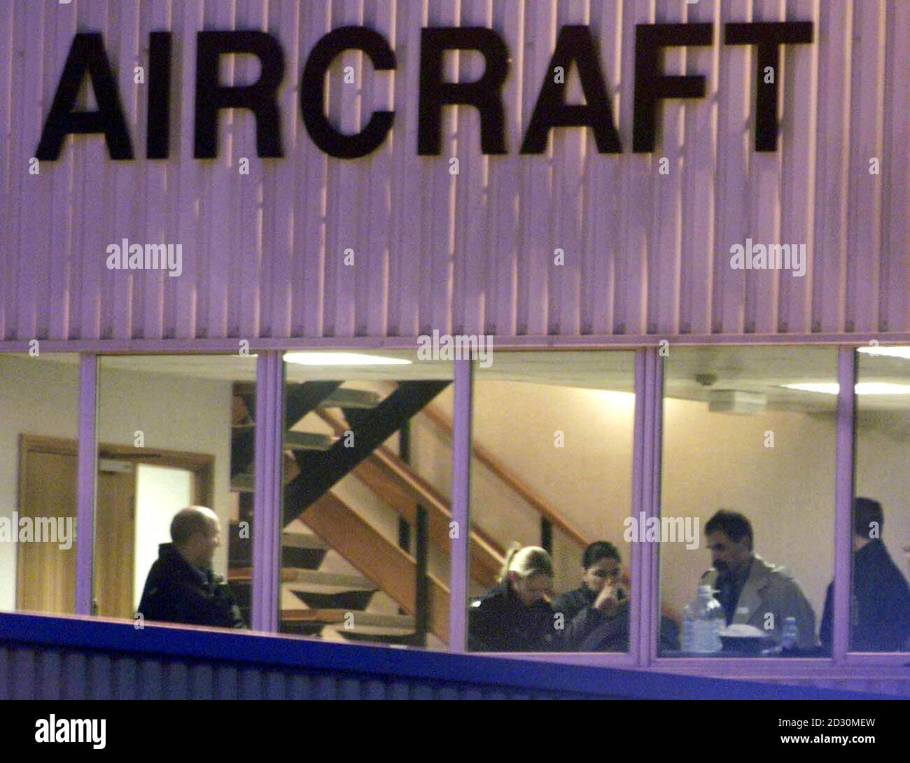 Hostages from the hijacked Ariana Boeing 727 at Stansted airport have their details processed at a hangar as all hostages are freed. The hostages started to leave the plane in the early hours of the morning after three day's of negotiations by Essex police. * The passengers were taken from the concrete apron of the airfield by bus to an undisclosed destination. Stock Photo