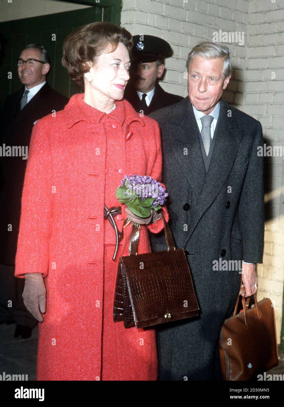 PA Photo 22/11/1963: The Duke and Duchess of Windsor arriving at Victoria Station in London. King of Great Britain and Northern Ireland in 1936, Edward VIII abdicated  in order to marry an American divorcee, Wallis Simpson (pictured). He was created Duke of Windsor in 1937.  Stock Photo