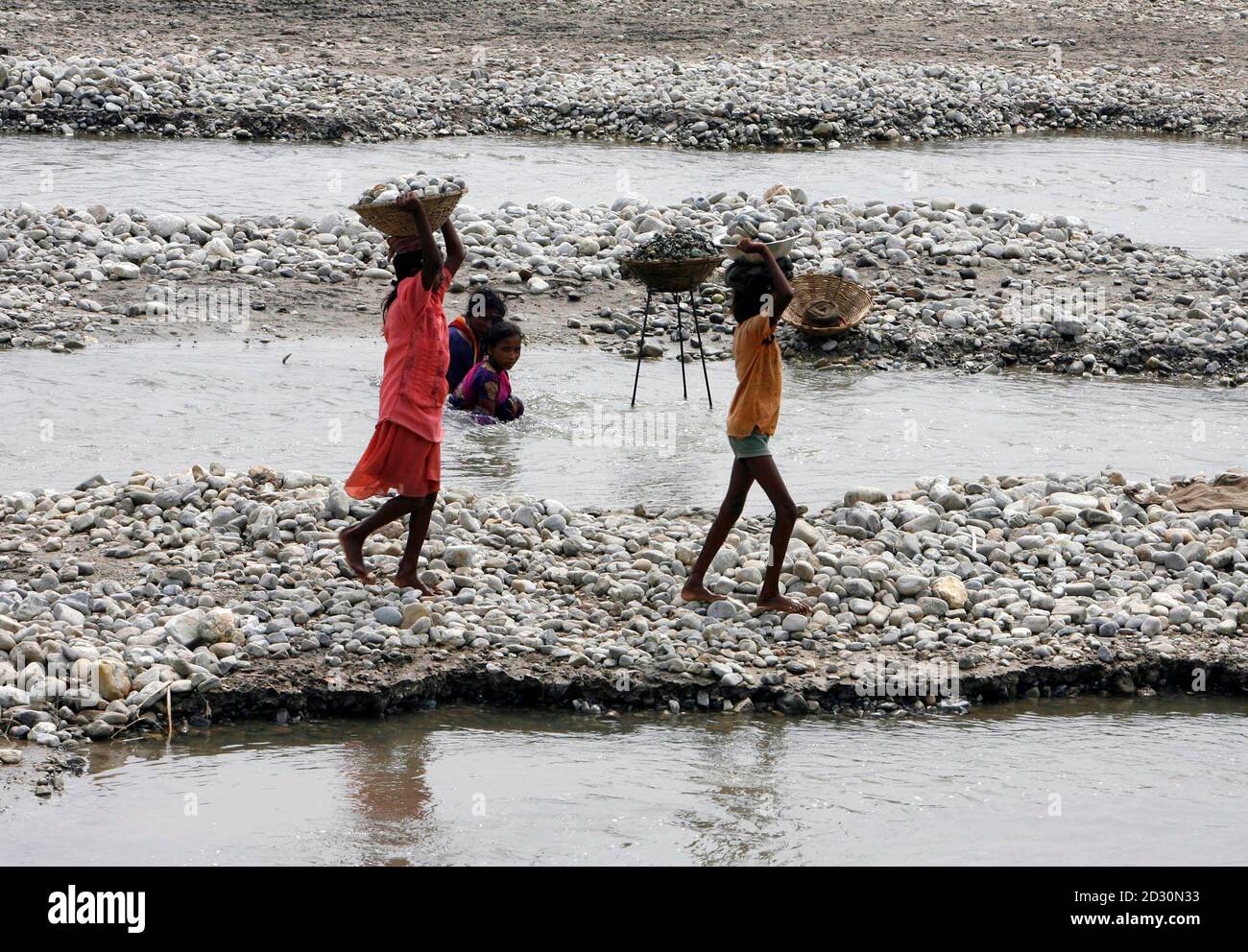 Child Labourers Carry Baskets Of Stones On The Banks Of River Balason On The Outskirts Of The Eastern Indian City Of Siliguri June 12 09 The International Labour Organization Ilo Celebrates World