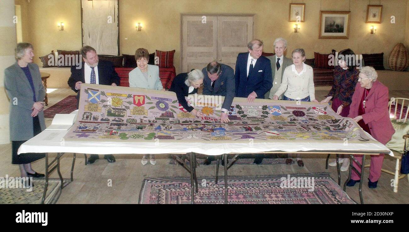 The Prince of Wales puts the last stitch in the final panel of the 267 ft New World Tapestry at his Highgrove House home in Tetbury, Gloucestershire.   * Looking on are from left Freda Penwarden (daughter of Freda Simpson), Tom Roncarelli (son of the late Chief Tapissier), Renee Harvey (Chief Tapissier), Barbara Peacock (Organiser of Lyme Regis Tapestry Centre whose group stitch the panel), The Prince of Wales, Tom Mor (Designer of the New World Tapestry), Paul Presswell (Heraldry Researcher New World Tapestry), Sheila Mor (wife of Tom Mor), Jill Taylor (Director Coldharbour Mill Educational T Stock Photo