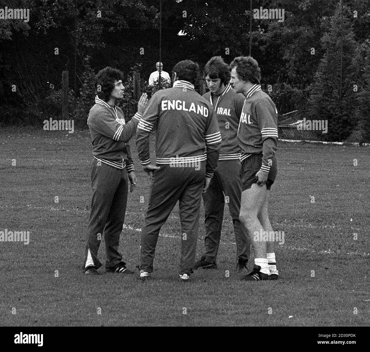 Liverpool's Kevin Keegan (left) puts his point of view during a tactical talk with (from left) manager Don Revie, Southampton's Mike Channon, and Manchester City's Joe Royle at the Dame Alice Owen School ground at Whetstone. * England are preparing for the World Cup qualifying match against Finland at Wembley. Stock Photo