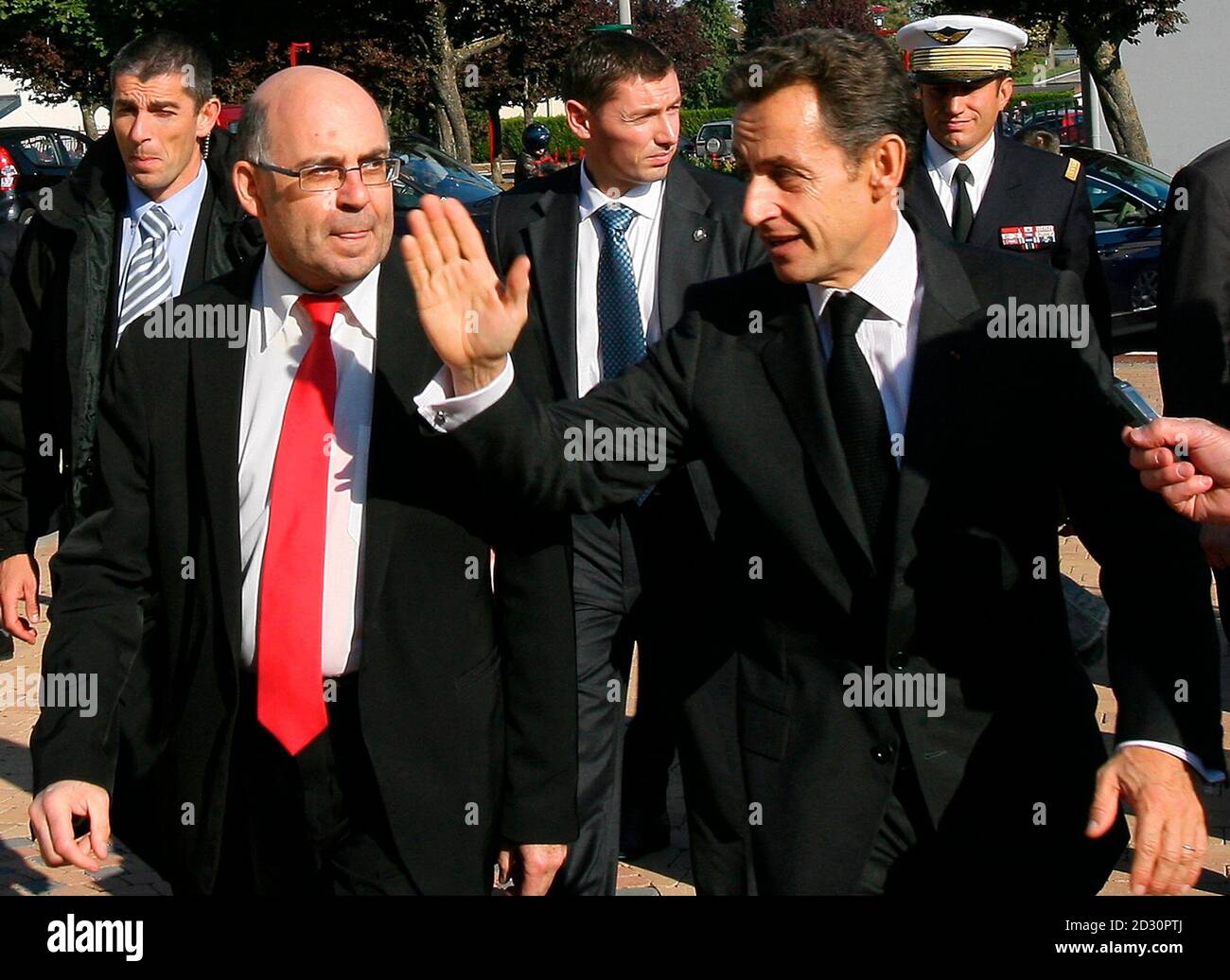 France's President Nicolas Sarkozy (R) and Henri Octave, Mayor of Gandrange, arrive for a meeting with union representatives of Gandrange's Arcelor-Mittal's steel factory and elected representatives at Gandrange city hall October 15, 2009.  REUTERS/Pascal Brocard/Le Republicain Lorrain/Pool   (FRANCE POLITICS EMPLOYMENT BUSINESS) Stock Photo