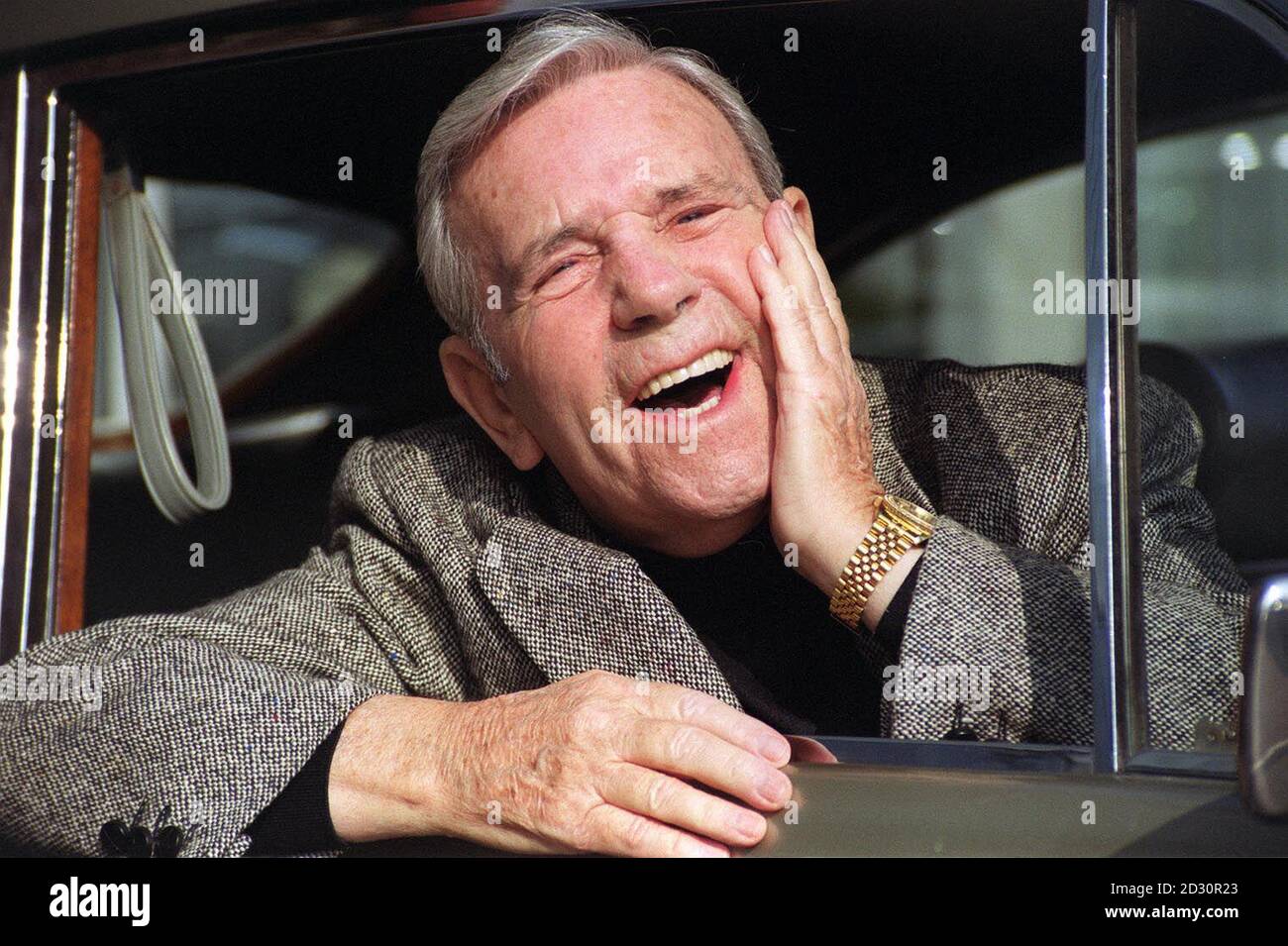 Comedian Norman Wisdom in London, saying farewell to his 1956 Bentley S1 Continental Fastback, which has an estimated value of between  40,000 and   50,000. The vehicle is being offered for sale at Christies exceptional Motor cars and Automobilia sale. Stock Photo