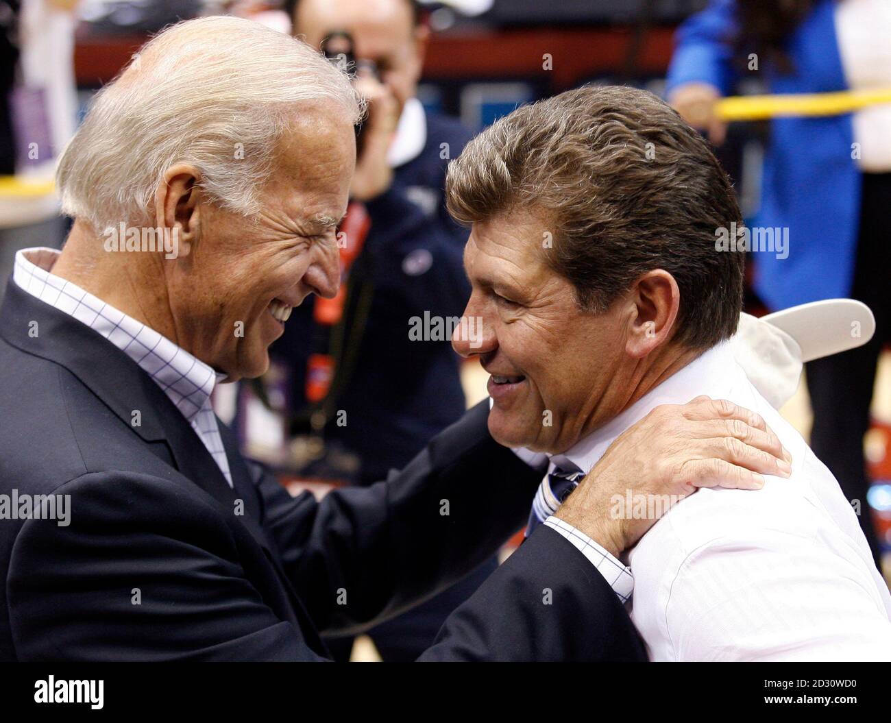 U.S. Vice President Joe Biden (L) congratulates Connecticut head coach Geno  Auriemma after the NCAA women's National Championship college basketball  game in San Antonio, Texas, April 6, 2010. Connecticut defeated Stanford,  53-47,