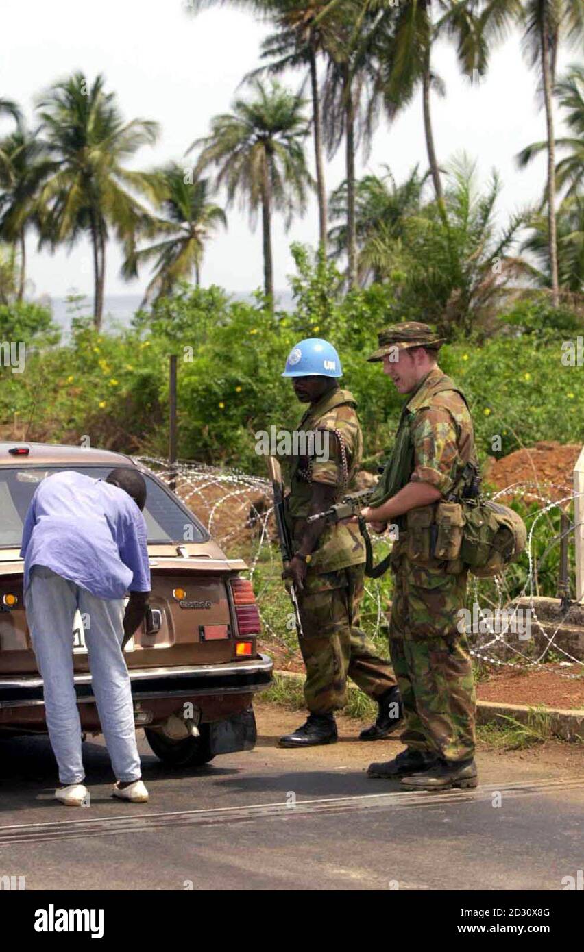 Pte. Ian Cheesman, a Para from Hull, right, at a vehicle check point in  Freetown, Sierra Leone with a Nigerian UN soldier.  UK and UN commanders in Sierra Leone confirmed today there had been 'friction' between British paratroopers and Nigerian soldiers.   *...based in the troubled west African country.   But both British forces and United Nations officers in the capital Freetown were determined to play down problems, insisting they would be quickly resolved by commanders on the ground. See PA News story DEFENCE Sierra Leone. Stock Photo