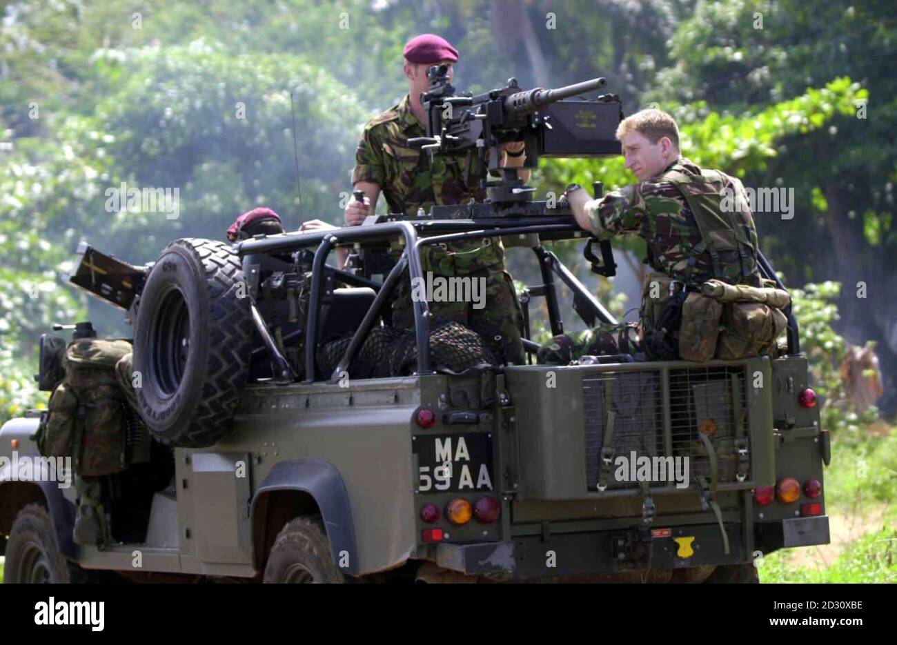 A British paratroop patrol patrolling the outskirts of Freetown, Sierra Leone, on the day Rebel leader Foday Sankoh was detained by pro-government forces in the country. Stock Photo