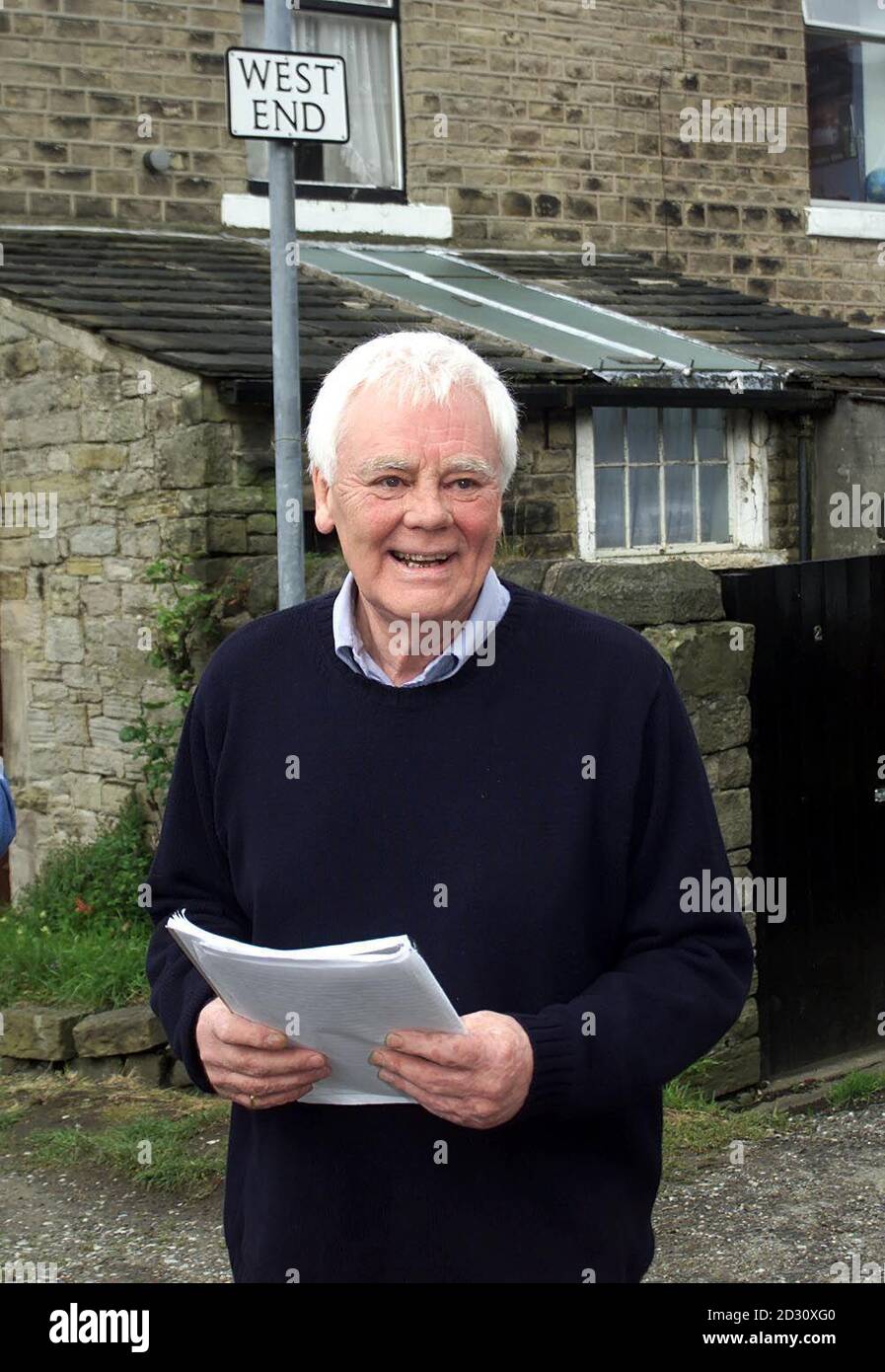 Actor Tony Booth, father of Cherie Blair approaches reporters outside