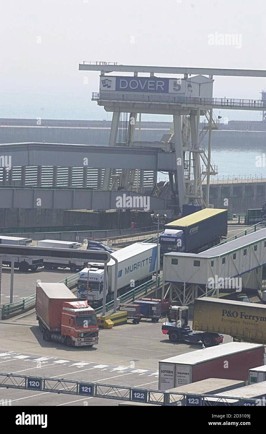 Haulage trucks disembark from the ferry terminal European Pathway following the discovery of a container holding illegal immigrants at Dover Dock. The two survivors of the illegal human trafficking racket which left 58 people dead are under police guard.  *   as the hunt began for those behind the tragic consignment.  Stock Photo