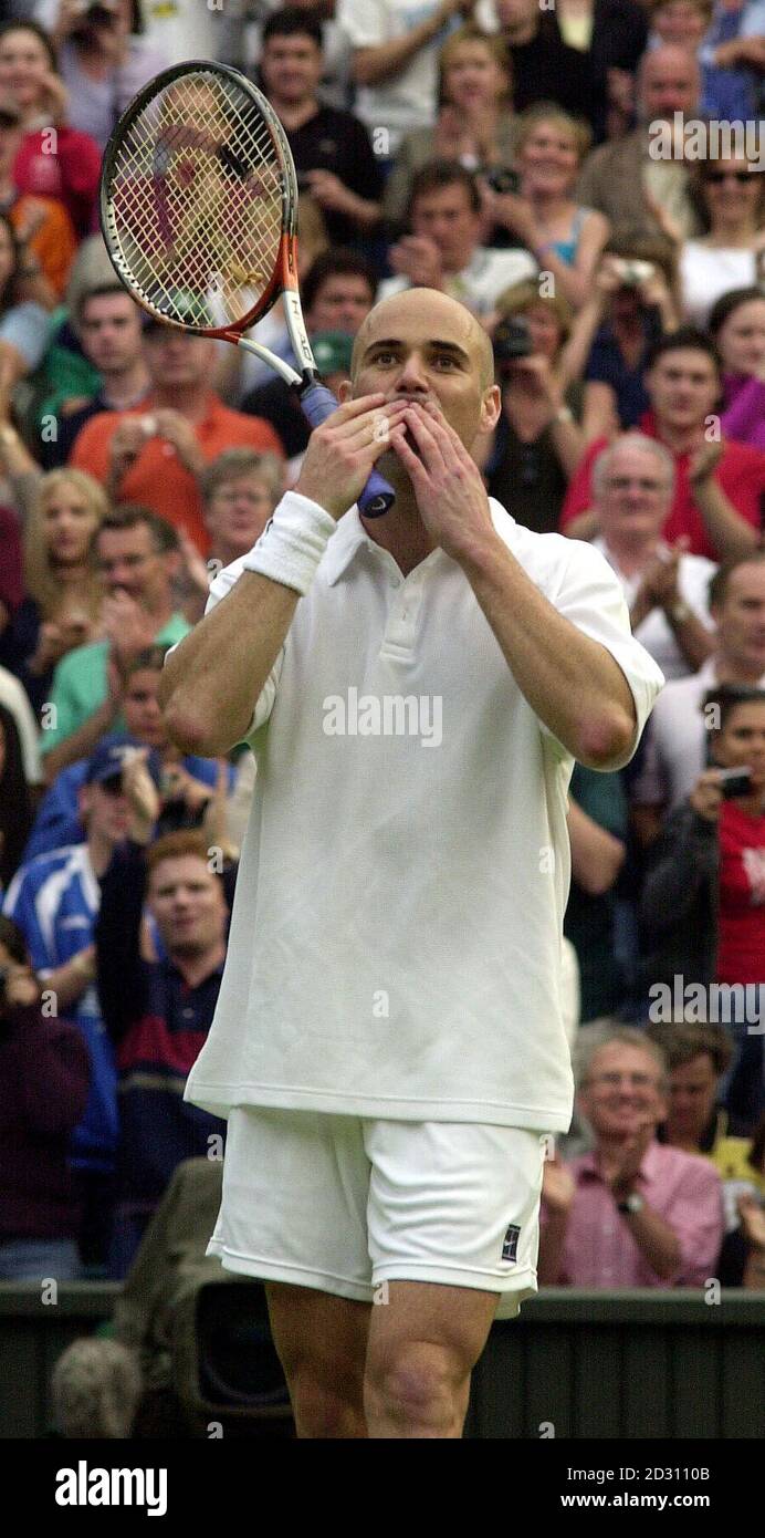 America's Andre Agassi celebrates his 6/2 3/6 0/6 0/4 victory over fellow American Taylor Dent during the second day of the Lawn tennis Championships at Wimbledon. Stock Photo