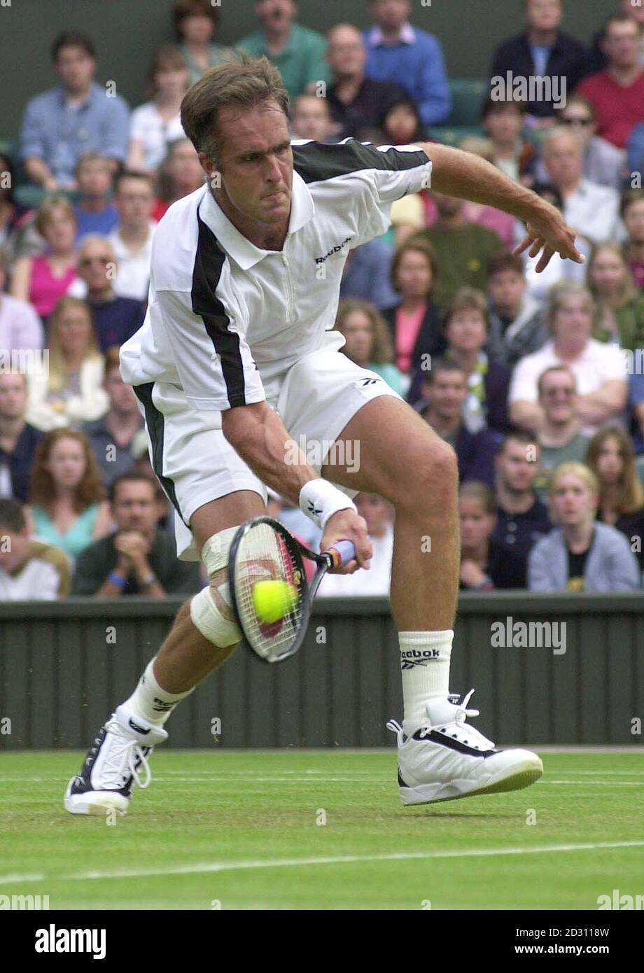America's Todd Martin in action against fellow American Andre Agassi ...