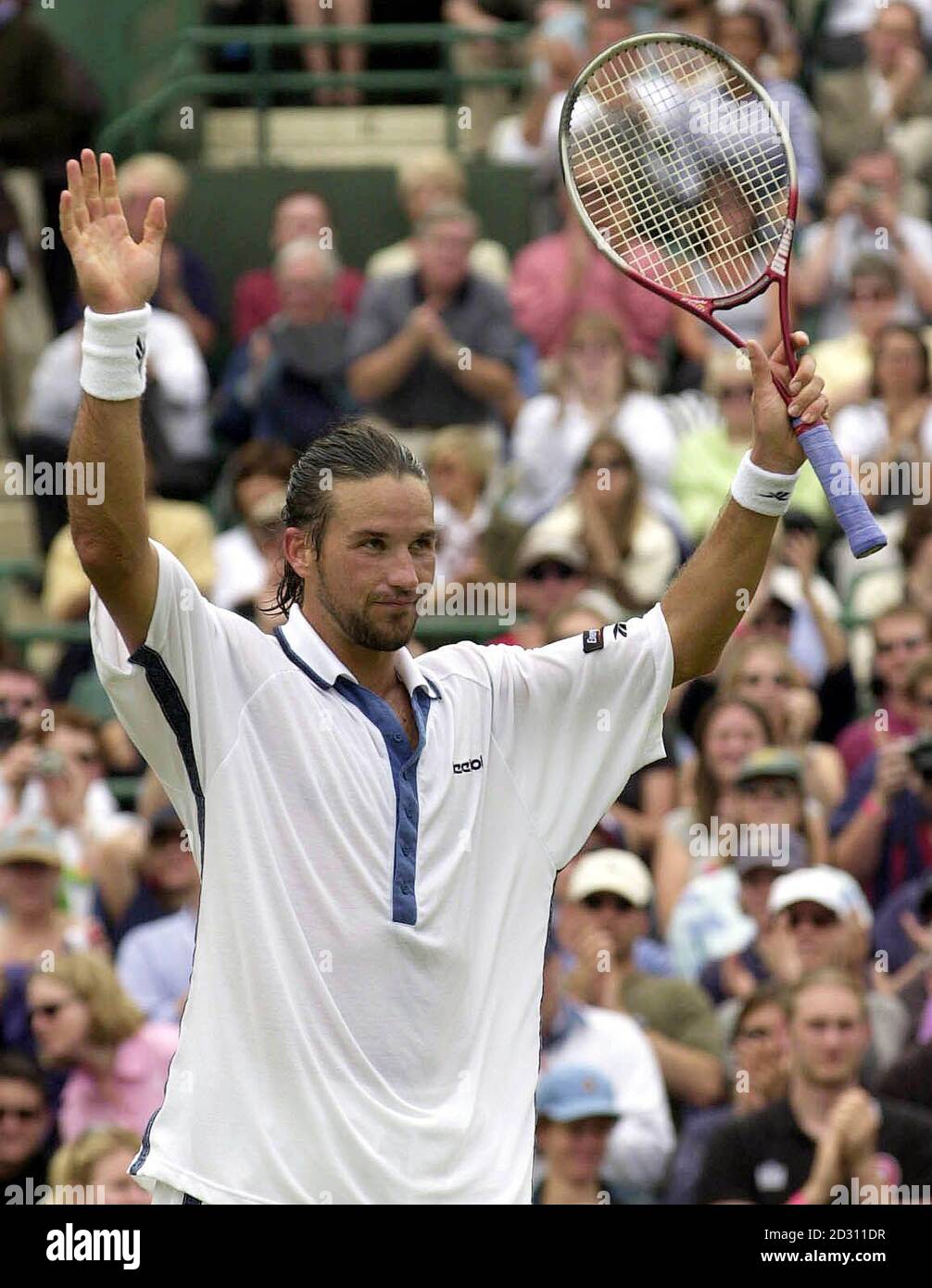 NO COMMERCIAL USE:   Australia's Pat Rafter celebrates his 6/2 7/6 6/3 victory over Rainer Schuttler of Germany during the Lawn Tennis Championships at Wimbledon. Stock Photo