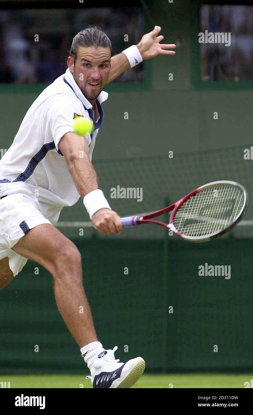 NO COMMERCIAL USE: Australia's Pat Rafter in action against Rainer Schuttler  of Germany during the Lawn Tennis Championships at Wimbledon Stock Photo -  Alamy