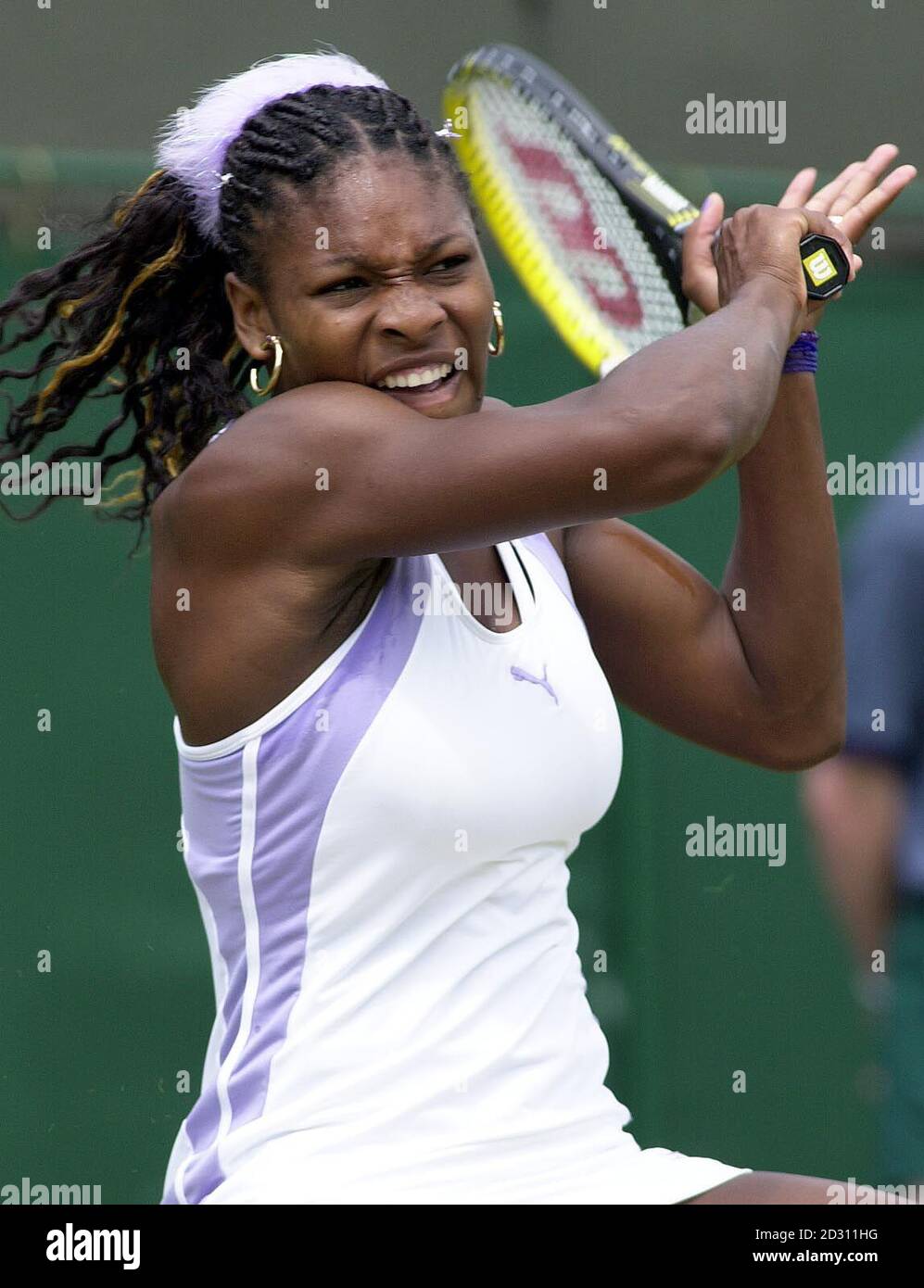 America's Serena Williams in action against Tamarine Tanasugarn of Thailand, during the Lawn tennis Championships at Wimbledon. Stock Photo