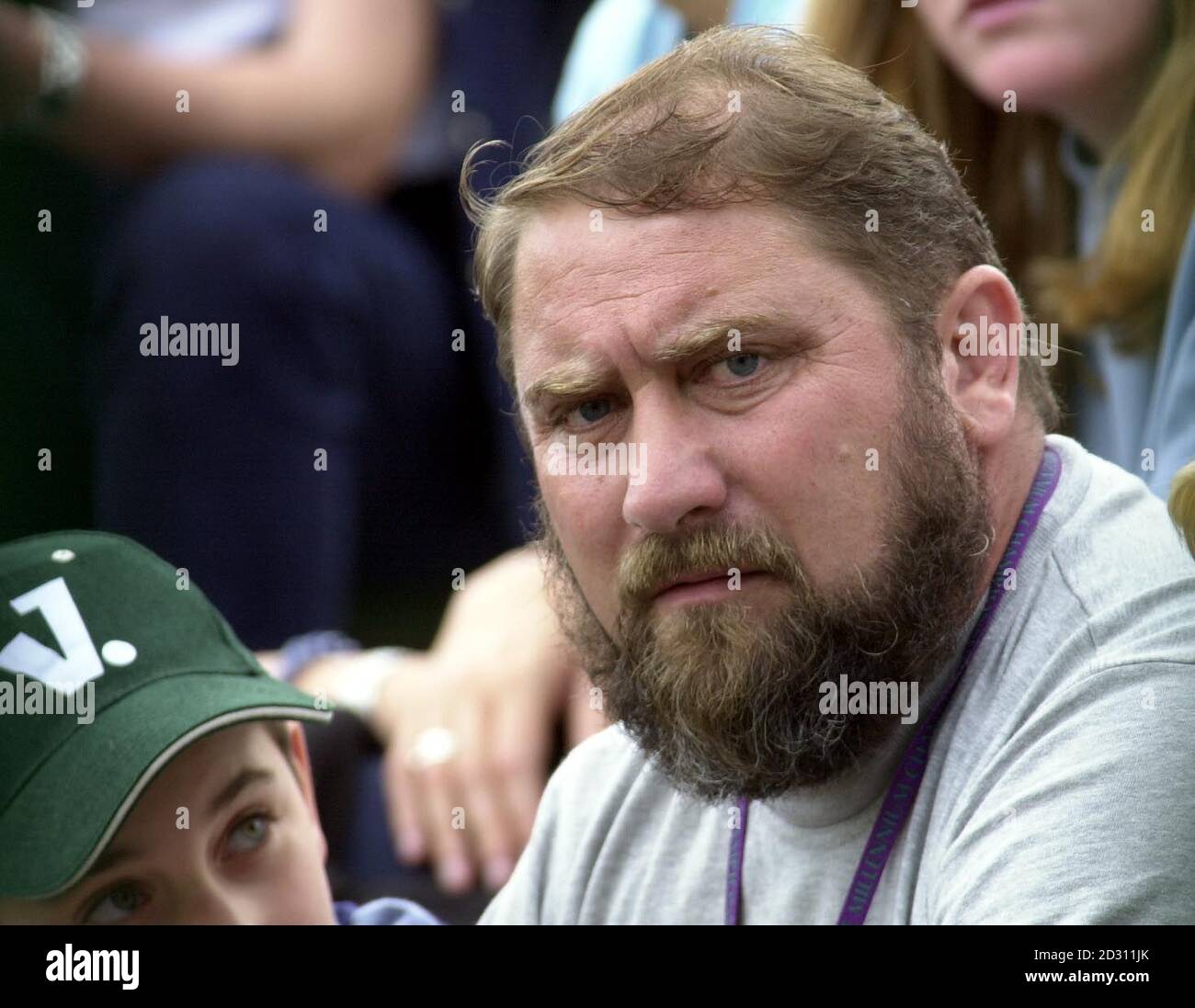 NO COMMERCIAL USE: Damir Dokic father of Australia's Jelena Dokic watches her in action against Kristina  Brandi of America at Wimbledon. Stock Photo