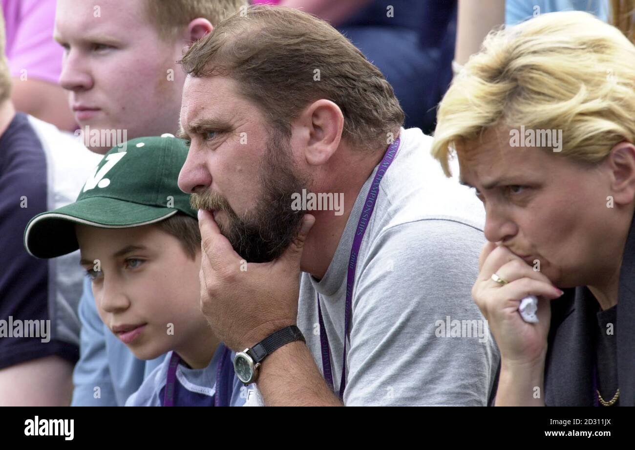 NO COMMERCIAL USE: Damir Dokic father of Australia's Jelena Dokic watches her in action against Kristina  Brandi of America at Wimbledon. Stock Photo