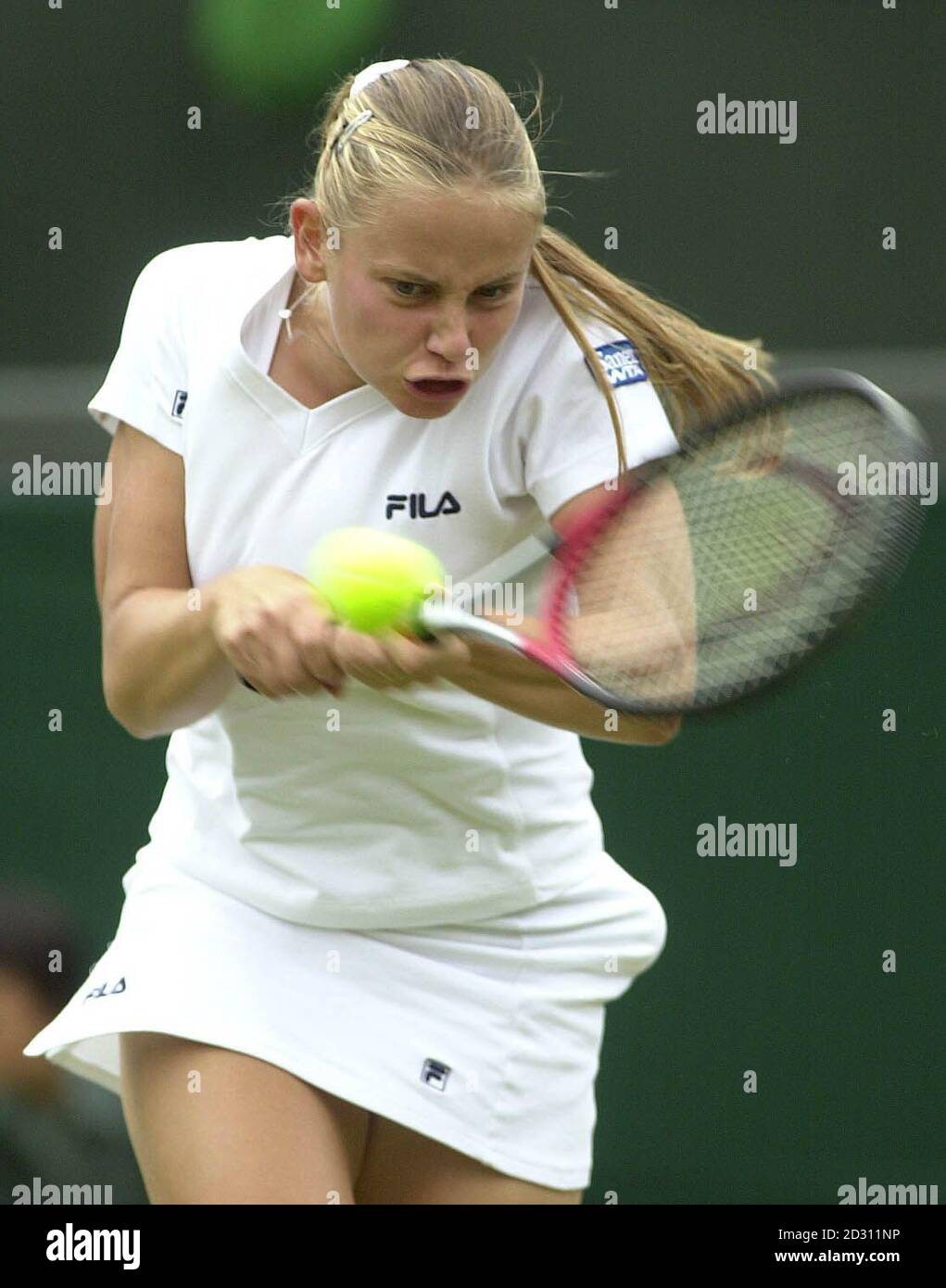 NO COMMERCIAL USE: Australia's Jelena Dokic in action against Magui Serna of Spain during the Lawn Tennis Championships at Wimbledon. Stock Photo