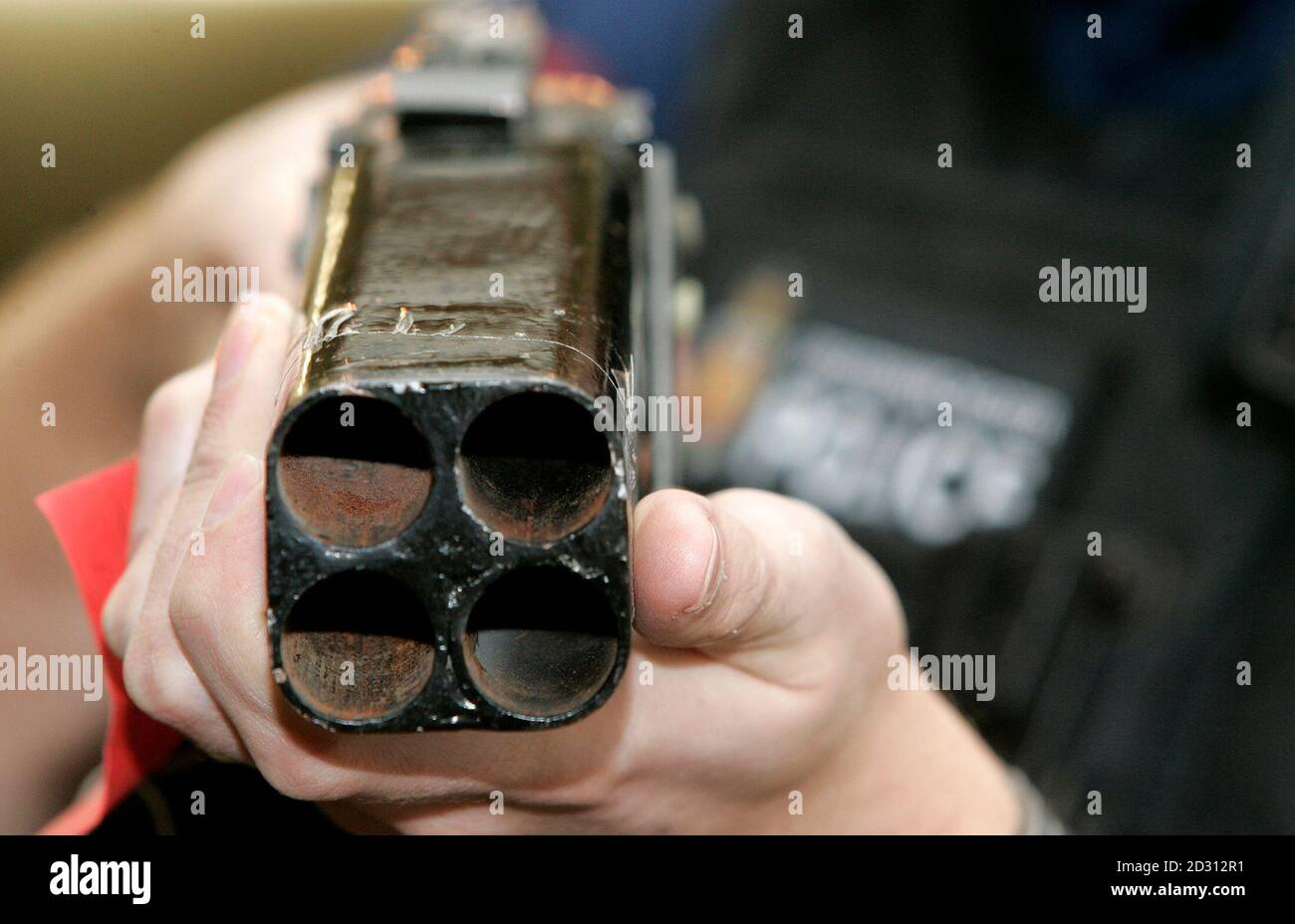 A Police Firearms Officer Displays A Homemade Four Barrelled Shotgun Part Of The Arsenal Of Weapons Handed In To The Greater Manchester Police Force During It S Gun Amnesty In Manchester Northern England November