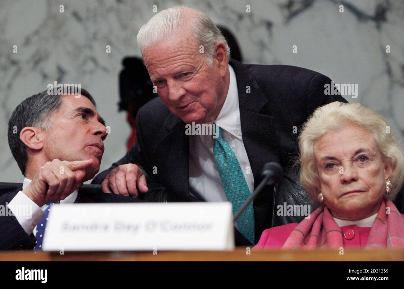 Former U.S. Secretary of State James Baker (C) speaks with fellow Iraq Study Group members former U.S. Senator Charles Robb (D-VA) (L) and former Supreme Court Associate Justice Sandra Day O'Connor a news conference on recommendations on the Iraq war on Capitol Hill in Washington, December 6, 2006.  REUTERS/Jim Young (United States) Stock Photo