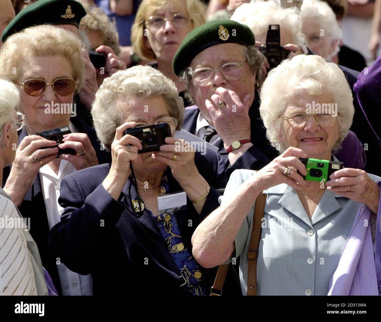 Former 'Ack Ack' girls and ATS members line up to take photographs of the retiring Speaker of the House of Commons, Betty Boothroyd, who was taking the Salute at their March Past following a Service in York Minster.   *... Ms Boothroyd was invited to take the salute in her role as patron of the Memorial to the Women of World War II Charity which is campaigning to have a tribute to women veterans erected in London.  Stock Photo