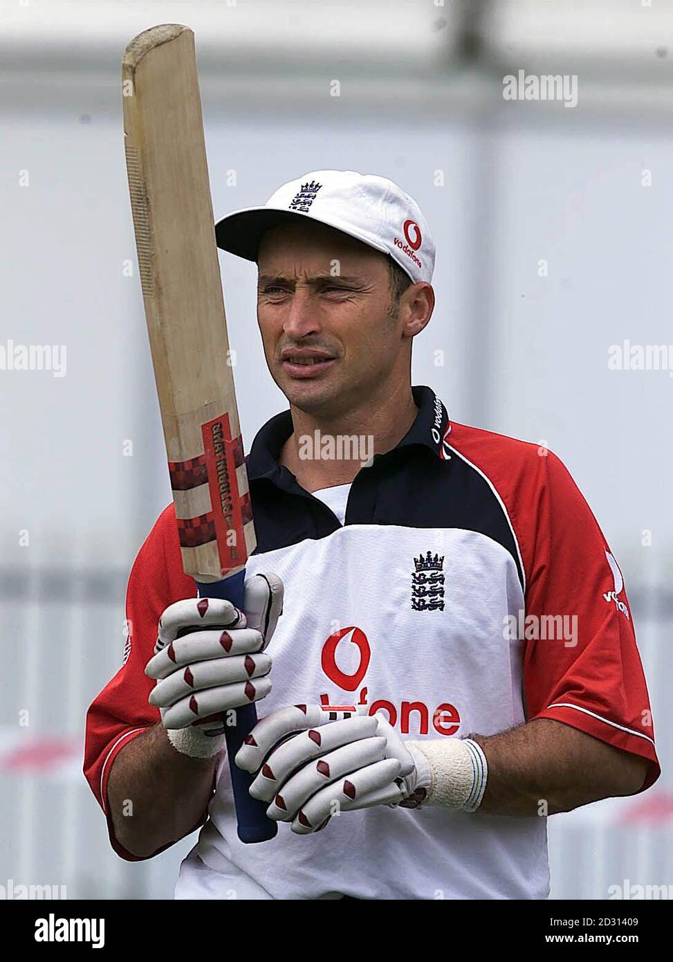 England Captain Nasser Hussain holds his bat during practice at Old Trafford, in Manchester, on the eve of their Third Test cricket match against the West Indies. Stock Photo