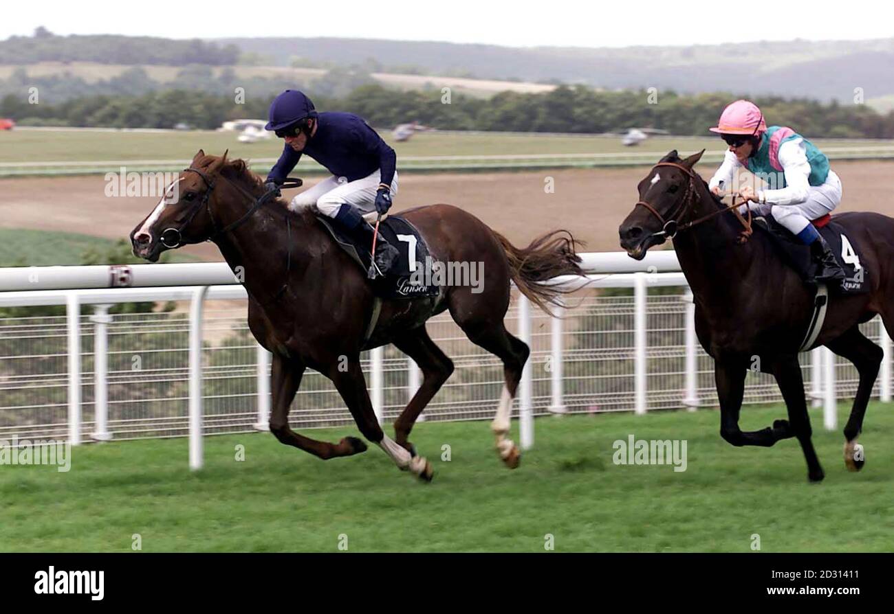 Mick Kinane on Giant's Causeway (7) pulls away from Dansili to win the Champagne Lanson Sussex Stakes at glorious Goodwood  the second of five days festival racing at the West Sussex track. Stock Photo