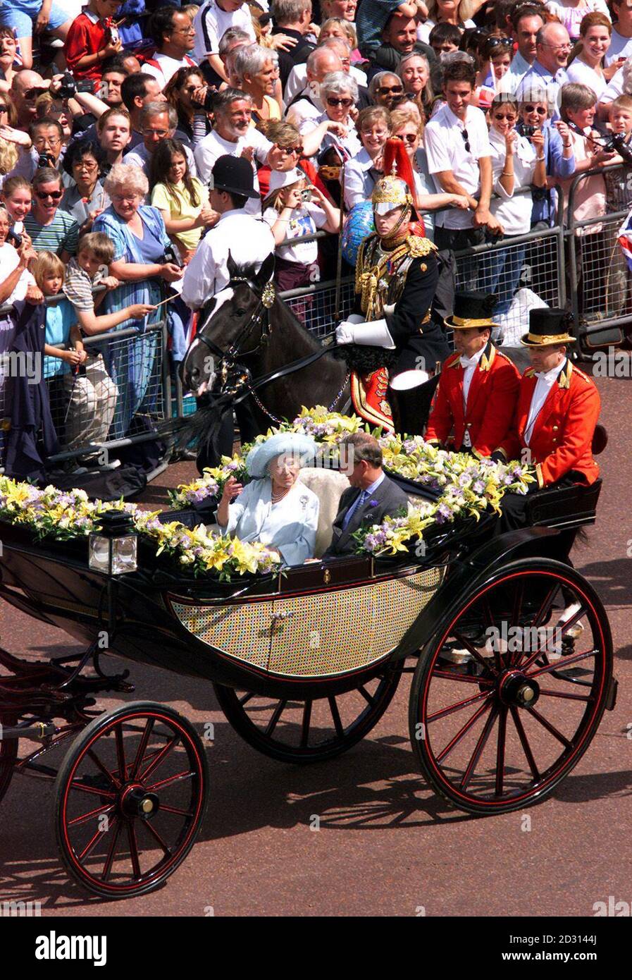 Queen Elizabeth The Queen Mother and Prince Charles drive down The Mall towards Buckingham Palace during her birthday celebrations. The Queen Mother turned 100 and travelled by horse-drawn carriage from Clarence House.  *  along the Mall to Buckingham Palace. Stock Photo